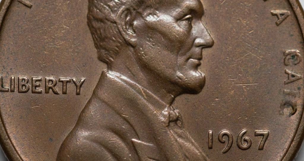 Close-up macro of a 1967 penny obverse with clear focus on no mint mark